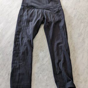 Lululemon 21" Black Leggings with slight cutouts down legs